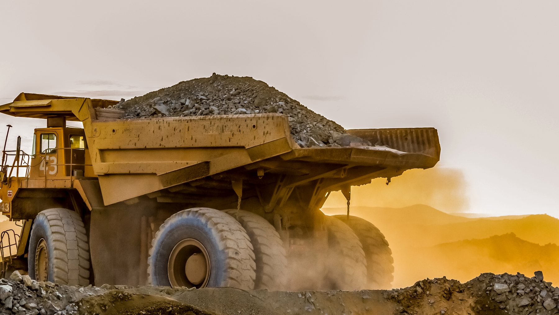 Mining truck carrying material at a mining site